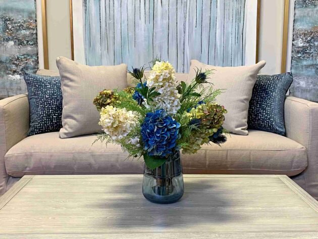 Assorted Hydrangea, Thistle and Fern Floral Arrangement in Colored Glass Vase - Image 2