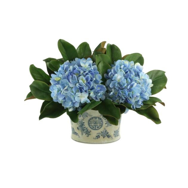 Hydrangea and Magnolia Leaf Arrangement in a Decorative Ceramic Pot